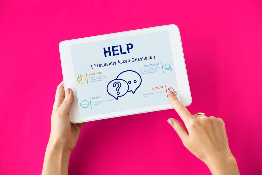 Hands holding a tablet displaying a help screen with question and support icons